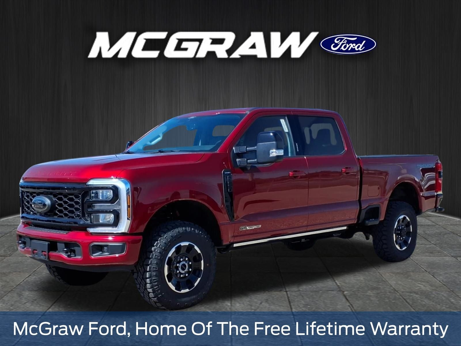 2026 Ford Super Duty F-250 Lariat in Ruby Red Metallic Tinted Clearcoat — front three-quarter view