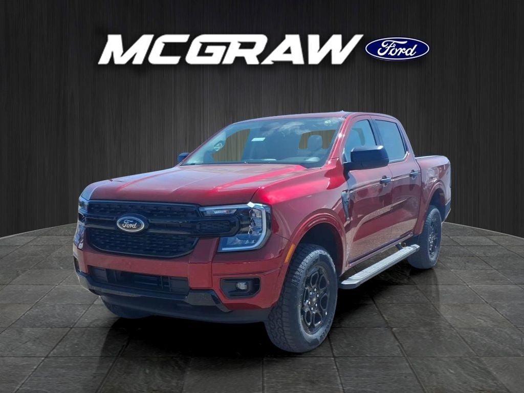 2026 Ford Ranger XLT in Ruby Red Metallic Tinted Clearcoat — front three-quarter view