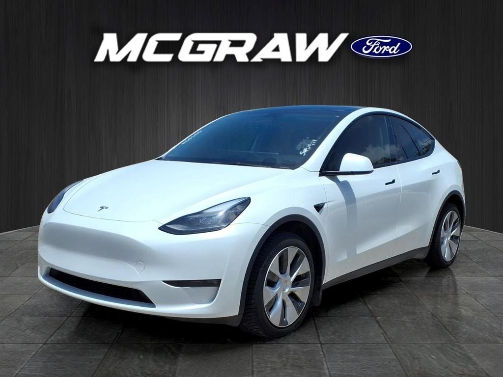 2023 Tesla Model Y Long Range in Pearl White Multi-Coat — front three-quarter view